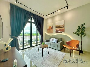 Comfort Apartment, 2 Bedrooms, Balcony, Garden View | Living area - Desaru Utama Residence by Stayrene (Bandar Penawar)