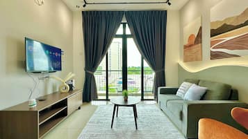 Departamento Confort, 2 habitaciones, balcón, vista al jardín | Área de sala de estar