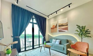 Apartment, 3 Bedrooms, Balcony, Garden View | Living area | Flat-screen TV - Desaru Utama Residence by Stayrene (Bandar Penawar)