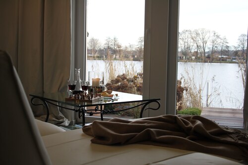 WasserWerk apartment - directly on the water, terrace, island view, jetty, sauna, wood-burning stove