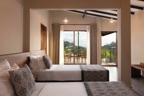 A hotel room with a large bed, a smaller bed, a balcony with a view, and a dining area. - Oak Ray Sky Terrace (Kandy)