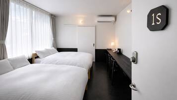 Twin Room, City View | Laptop workspace, blackout drapes, iron/ironing board, free WiFi