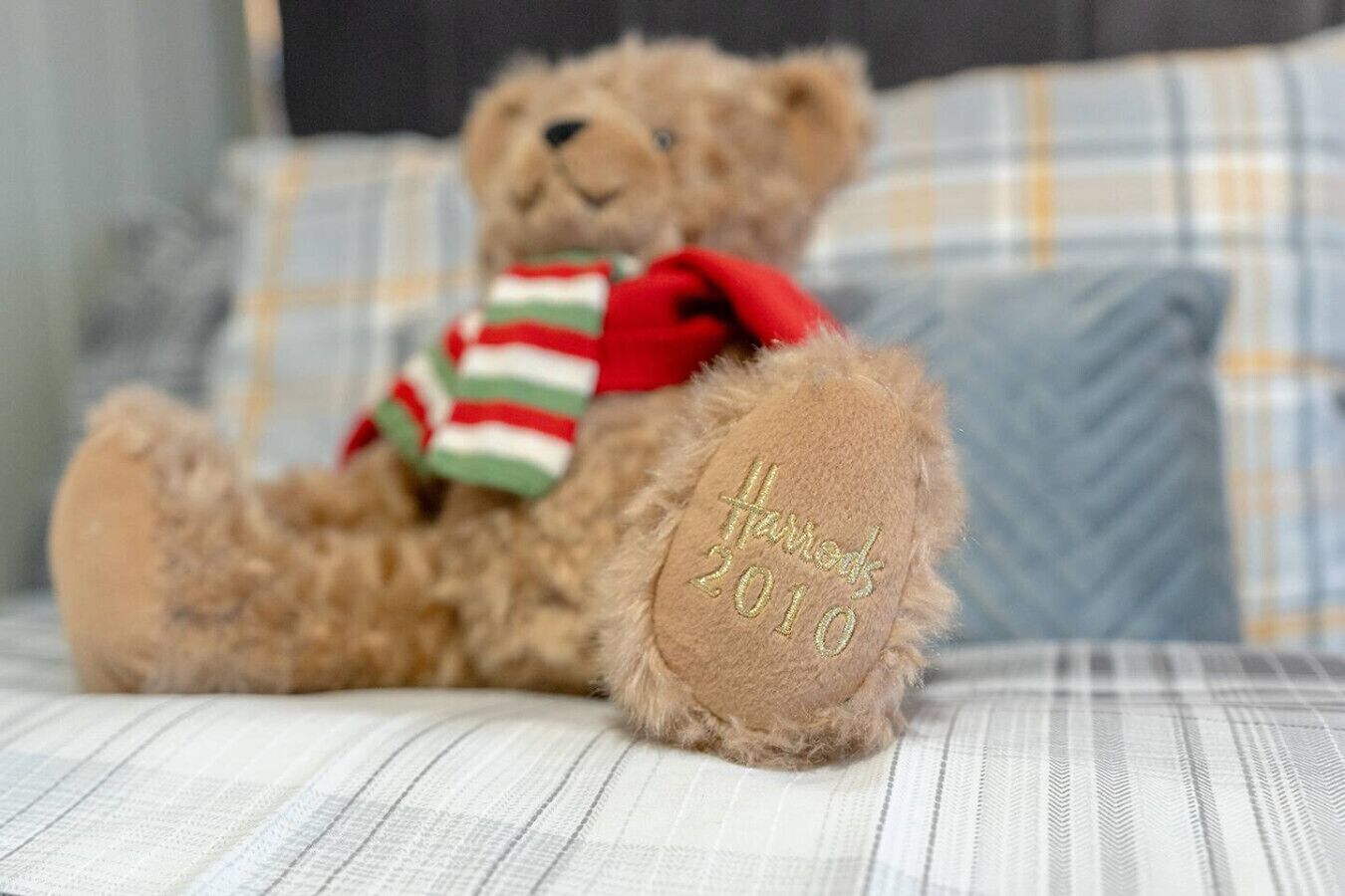Small teddy placed on the bed as a decorative detail