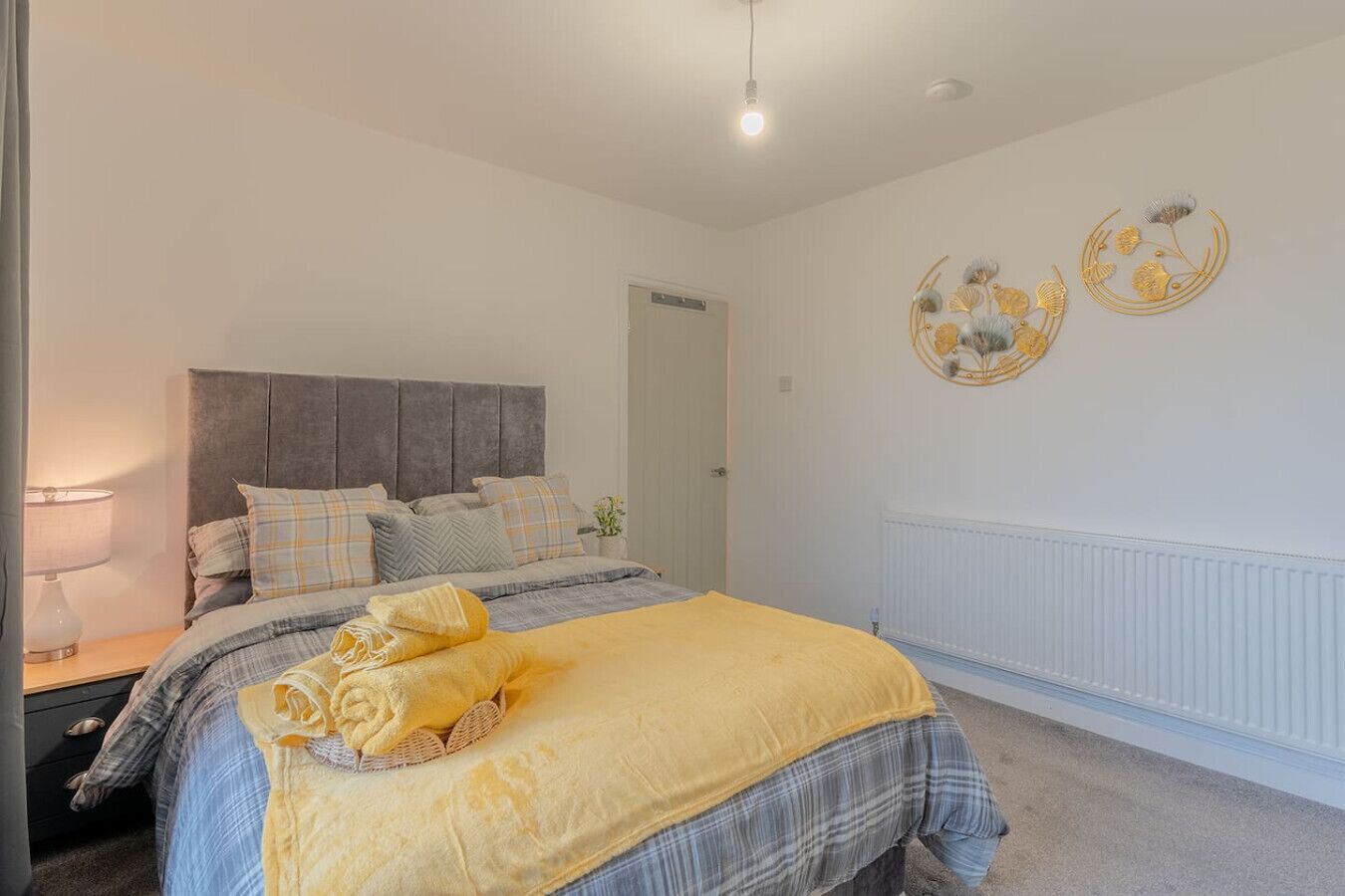 Wind down in the bedroom with a double bed and simple, uncluttered layout.