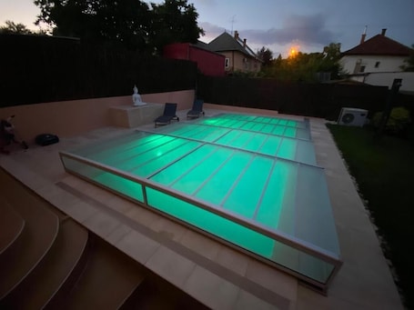 Outdoor pool, a heated pool. GARDEN SPA RESORT - A private apartment with heated pool, terrace, and garden.