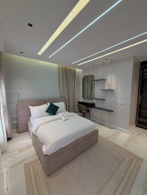 Family Room, Balcony, City View | Desk, laptop workspace, blackout drapes, soundproofing - JJ Hotel and Suites (Benin City)