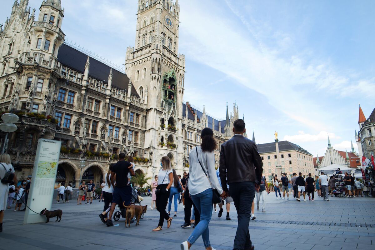 A historic building with intricate architecture and a large open plaza.