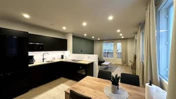 Standard Apartment, City View | Living area | Flat-screen TV