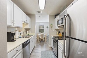 Fridge, microwave, oven, stovetop - Ground Level Private Beach Home w/Pool & Beach Access- Adorable and affordable! (Gulf Shores)