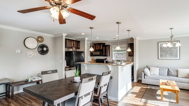A modern kitchen with dark wood cabinets, a central island, and pendant lighting. - 5 Mi to Sesquicentennial State Park: Quiet Home (Columbia)