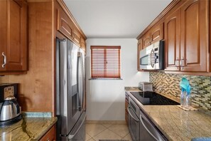 Condo, 2 Bedrooms | Private kitchen | Coffee/tea maker, fridge, oven, toaster - Menehune Shores, #522 2 Bedroom Condo (Kihei)