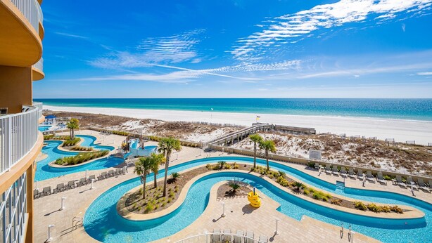A resort with a pool area, beach access, and a clear view of the ocean. - Phoenix Gulf Towers 302 2 Bedroom Condo (Orange Beach)