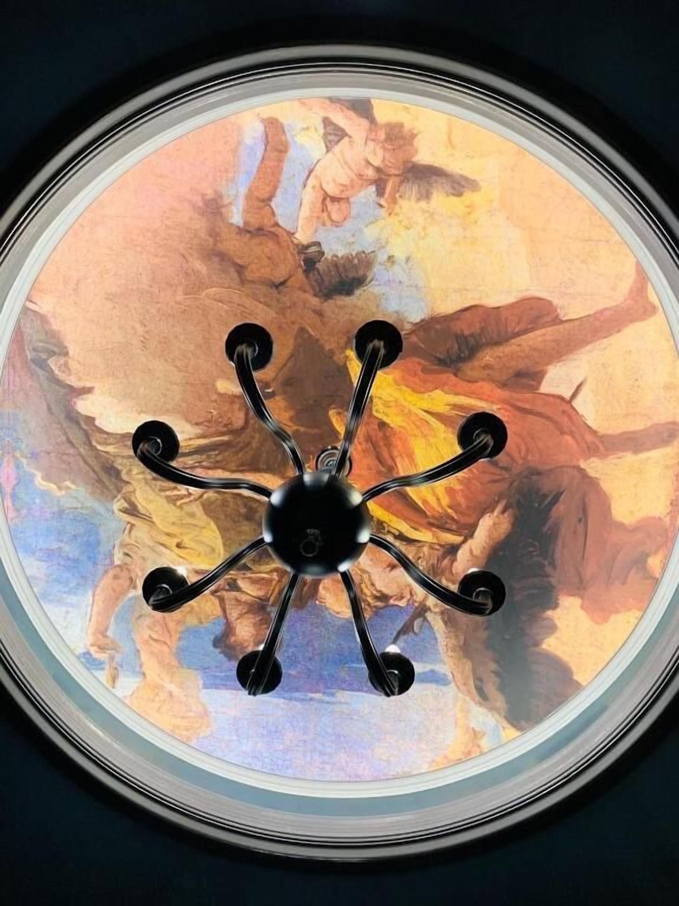 A ceiling with a central black fixture and a painted mural.