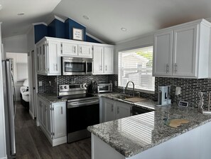 Coffee/tea maker, fridge, microwave, oven - 2- bedroom getaway walking distance to shops, restaurants, beaches and more. (Jensen Beach)