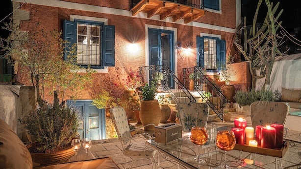 An outdoor seating area with a table, chairs, and candles. - The 1813 Painter s House by Neuvel (Delphi)