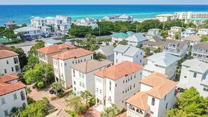 A coastal residential area with white buildings, red-tiled roofs, and a view of the ocean. - 🏖️Private Pool-Pet Friendly-Short Walk to Beach-Villa Palmeira🏖️ (Santa Rosa Beach)