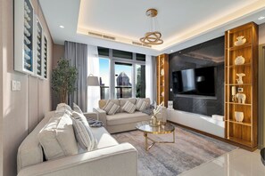 Deluxe Apartment, City View | Living area | Toys - Gogoto 1BR Infinity Pool High Floor (Dubai)