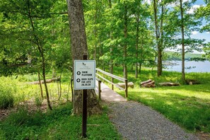 A sign indicating a swim platform and dock slips for lots 28, 29, 30 at a lakeside park. - New! Dog Friendly Lake Access Home w/ Hot Tub (Swanton)