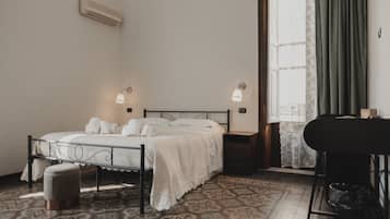 Tabla de planchar con plancha, wifi y ropa de cama