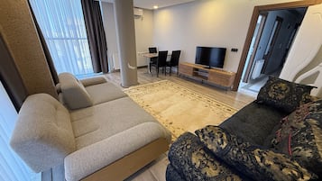 디럭스 아파트, 시내 전망 | 거실 공간