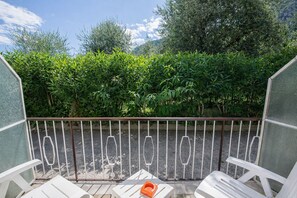Family Triple Room, Garden View | Property grounds - Hotel Garden  (Limone Sul Garda)