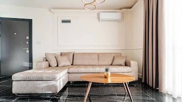 Deluxe appartement, uitzicht op zee | Woonruimte