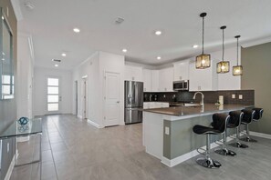Fridge, microwave, oven, stovetop - Spacious 9BR w/ Pool & Theater at Storey Lake (Kissimmee)