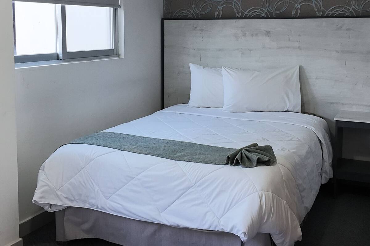 Standard Suite | In-room safe, desk, laptop workspace, iron/ironing board