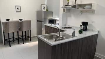 Family Studio | Private kitchen | Fridge, microwave, cookware/dishes/utensils
