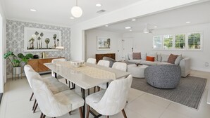 A modern living space with a dining area, seating, and artwork. - "La Veranda" a Movie Colony Palm Springs Resort Pool and View Home, #069334 (Palm Springs)
