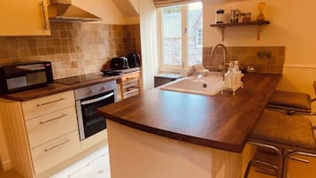 The Hayloft, Luxury loft style cottage, courtyard views | Private kitchen