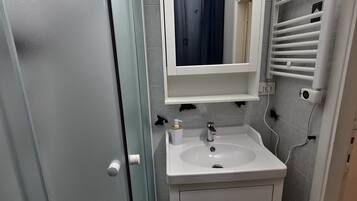 Hair dryer, towels, soap, toilet paper