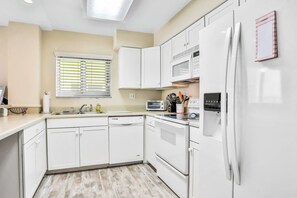 House, Multiple Beds, Balcony, Ocean View (Daytona Surfside Club 109- Blue) | Private kitchen - Daytona Surfside Club 109- Blue Umbrella (Daytona Beach Shores)