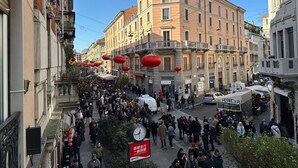 A crowded street with historic buildings, red lanterns, and a clock. - Morazzone suite - Chinatown (Milano)