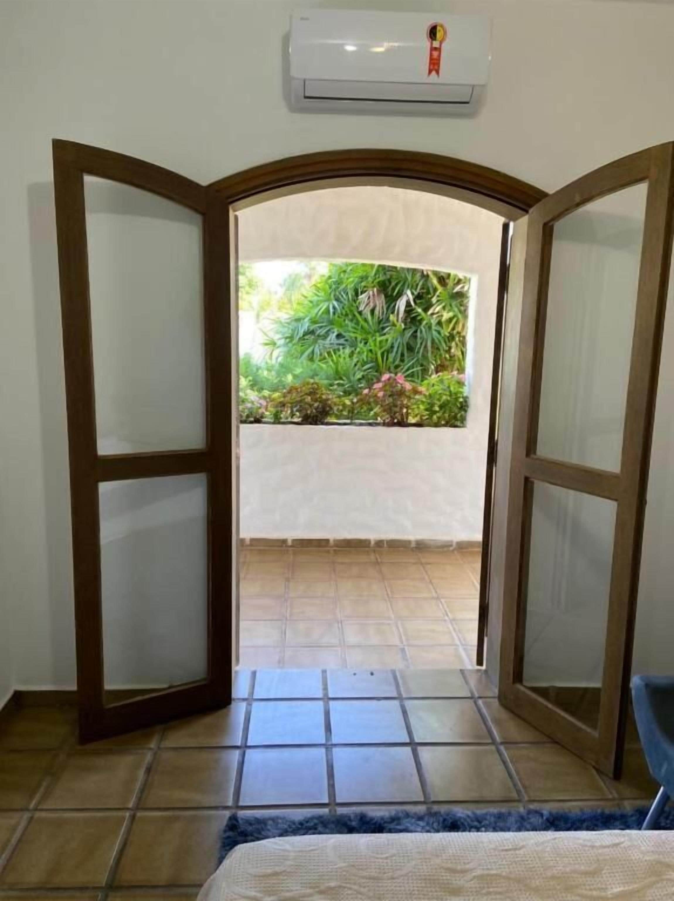 Quarto triplo conforto, vista para o jardim | Parte interna