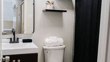 A spacious bathroom with double sinks, generous counter space, and plenty of storage— ideal for comfort, convenience and easy mornings.
