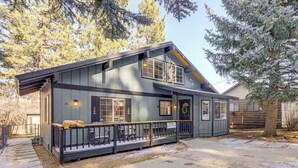 A two-story house with a porch, a small shed, and a tree in the yard. - < 1 Mi to Bear Mtn! Family Ski Cabin w/ Game Room (Big Bear Lake)