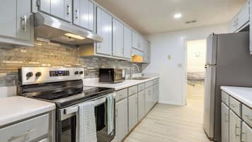 Fridge, microwave, stovetop, coffee/tea maker