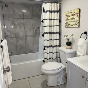 Hair dryer, towels, soap, shampoo