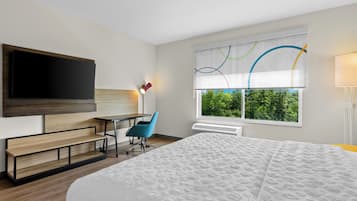 Desk, laptop workspace, blackout drapes, iron/ironing board