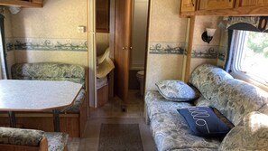 Living area - 29 ft travel trailer on private campground sleeps 7 in Interlochen (Interlochen)