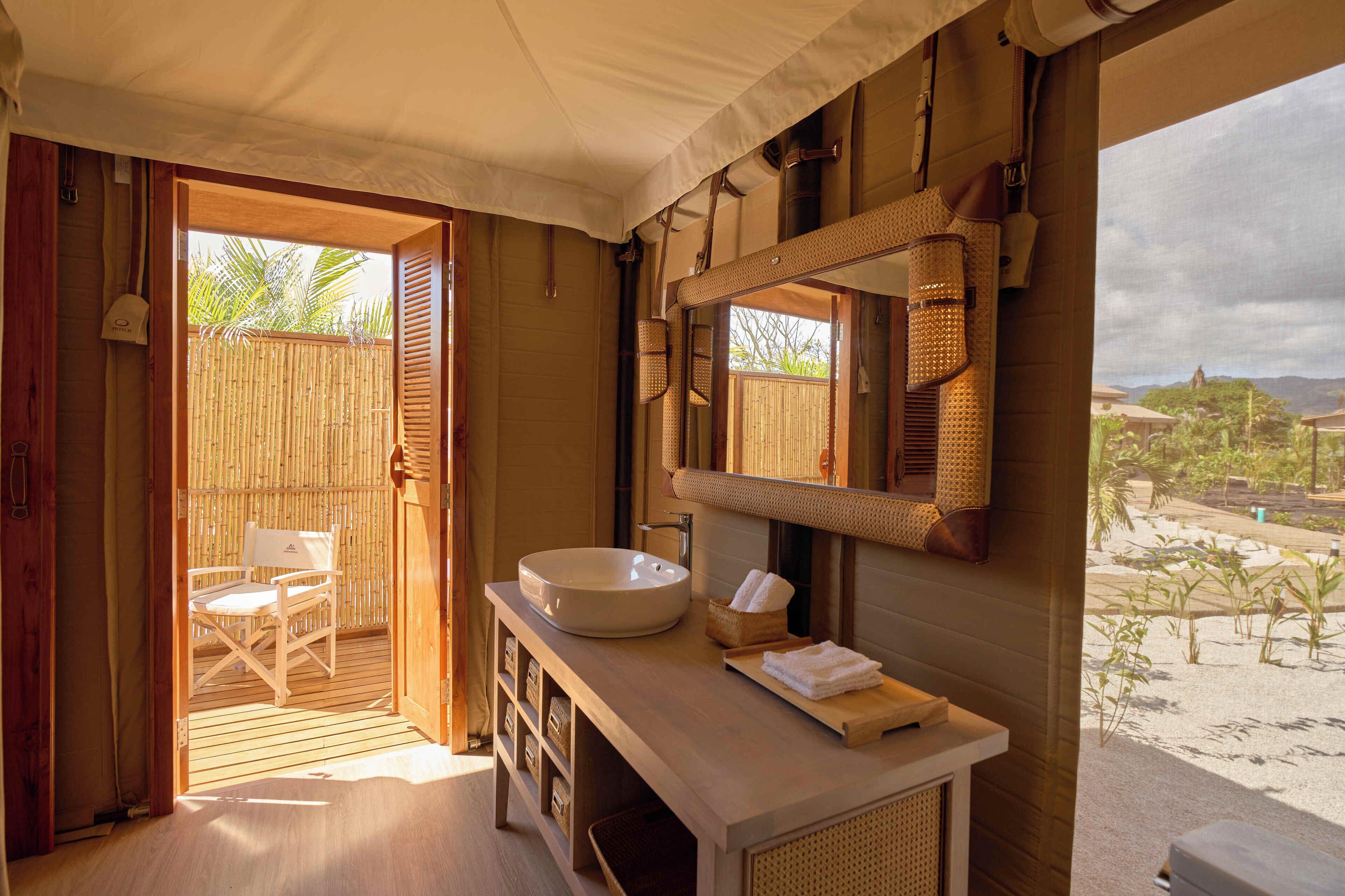 Shower, rainfall showerhead, slippers, towels