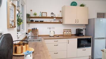 Fridge, microwave, coffee/tea maker, toaster