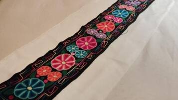 A long, narrow piece of fabric with a colorful floral pattern.