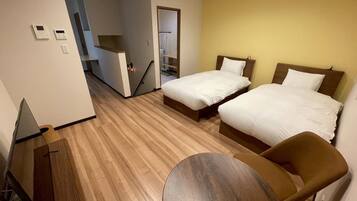 Deluxe Apartment, Garden View | Desk, free WiFi