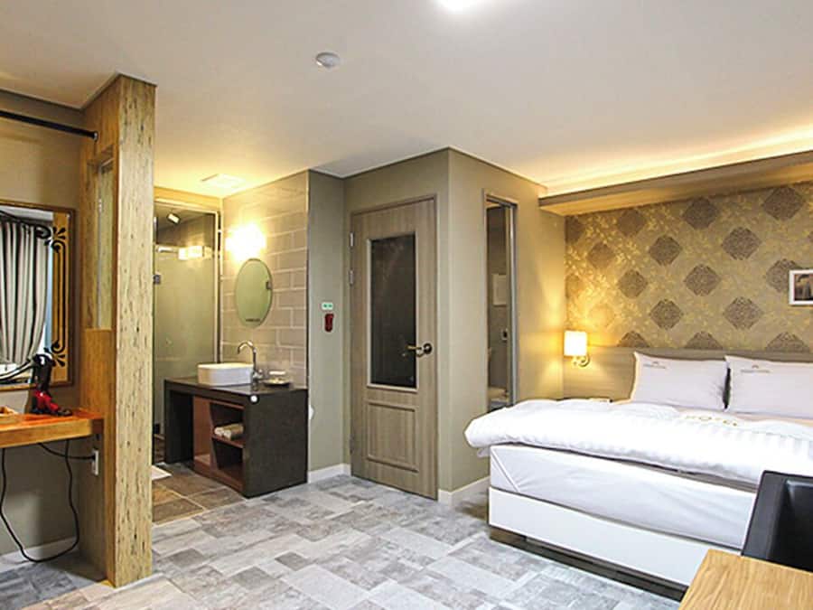 Premium bedding, pillow-top beds, desk, laptop workspace