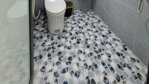 A bathroom with a toilet, bidet, sink, and a shower. - Minh Anh Hotel (Hung Nguyen)