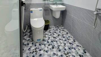 Shower, hair dryer, slippers, towels