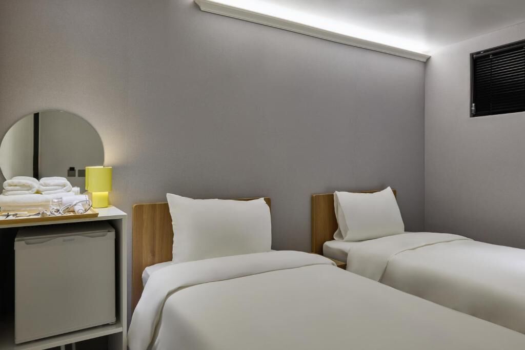 Standard Twin Room | Blackout drapes, iron/ironing board, free WiFi