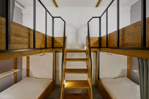 A bunk bed room with a central ladder, wooden walls, and a white ceiling. - Halfrest Hostel Jongno Insa (Seoul)